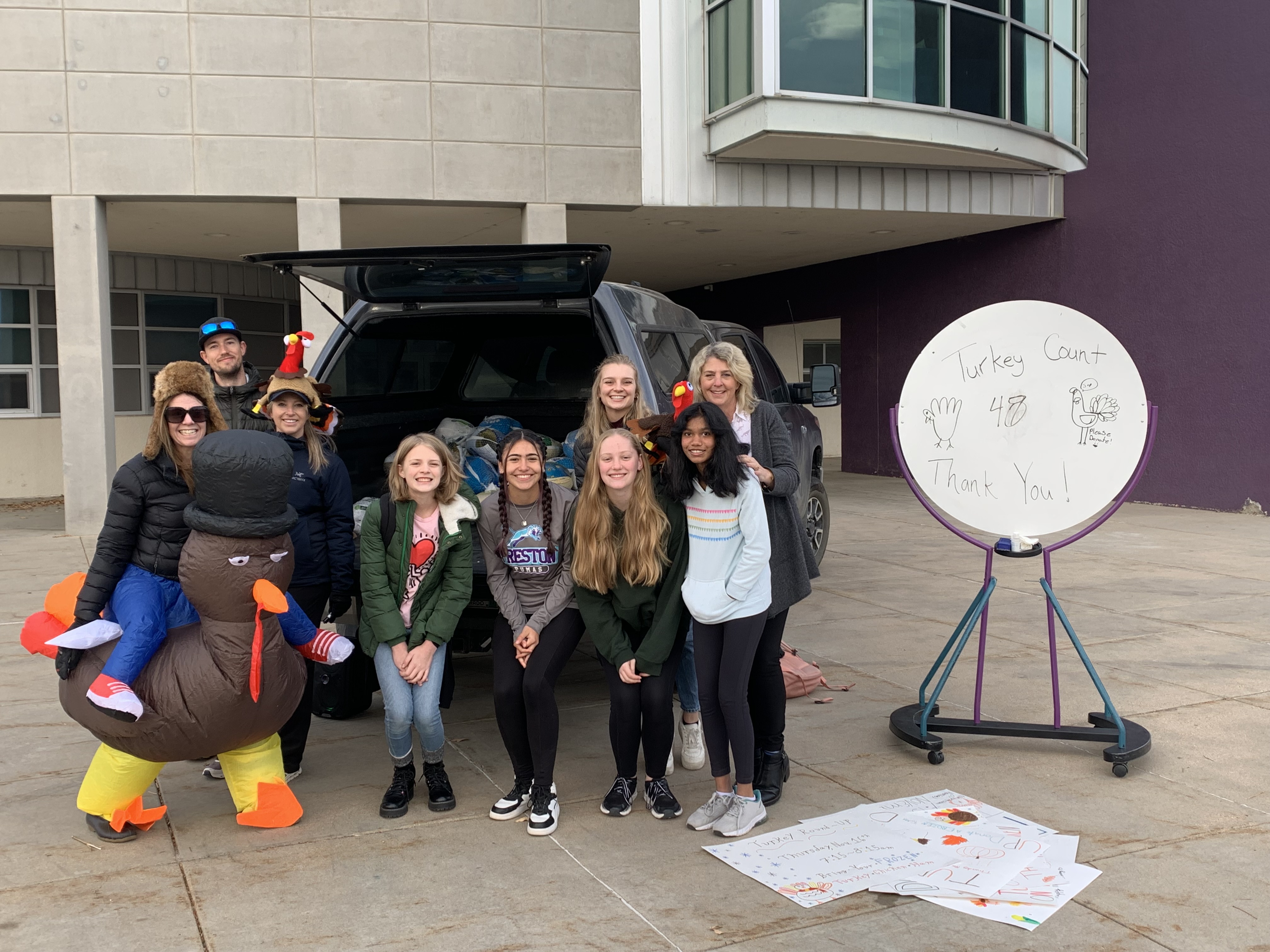 Group pic of web leaders collecting donated turkes